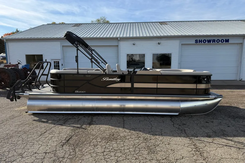 Slide: The Image of 2026 Bentley Pontoons Legacy 223 Navigator in front of a showroom. - 4