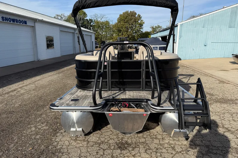 Slide: The Image of 2026 Bentley Pontoons Legacy 223 Navigator at a showroom, rear view. - 6