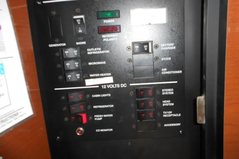 Slide: The Image of Electrical control panel on a 2008 Sea Ray 260 Sundancer boat. - 17