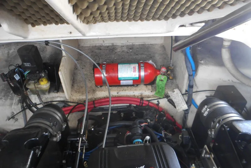 Slide: The Image of Engine compartment of 2008 Sea Ray 260 Sundancer with fire extinguisher and wiring. - 24