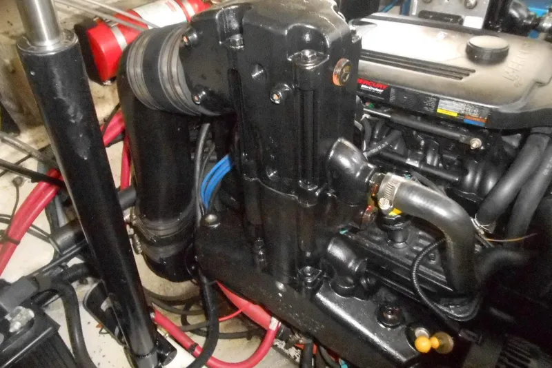 Slide: The Image of Engine compartment of a 2008 Sea Ray 260 Sundancer boat, featuring detailed components. - 26