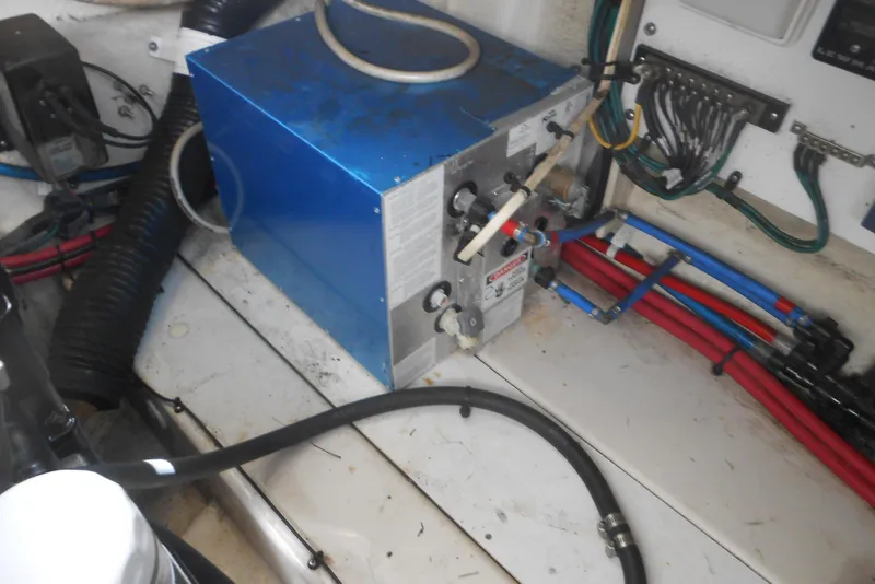 Slide: The Image of Engine room of 2008 Sea Ray 260 Sundancer with blue machinery and wiring. - 27