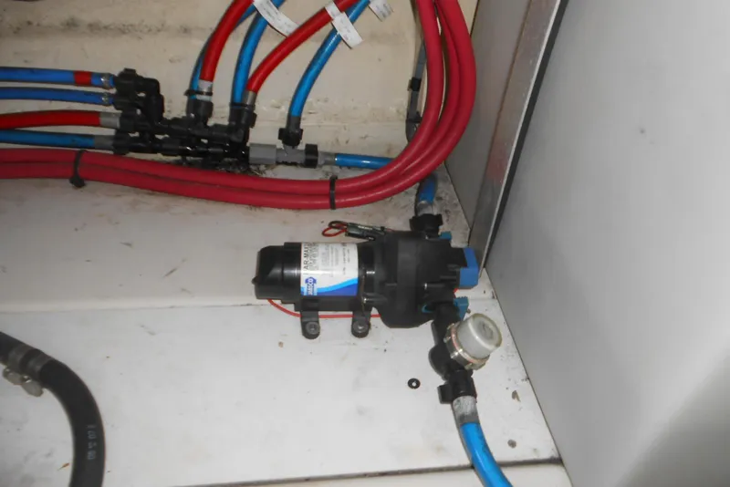 Slide: The Image of Plumbing system in 2008 Sea Ray 260 Sundancer boat with red and blue hoses. - 29