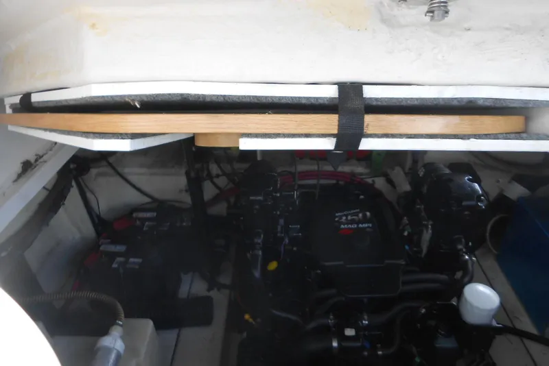 Slide: The Image of Engine compartment of a 2008 Sea Ray 260 Sundancer boat, showing mechanical components. - 31