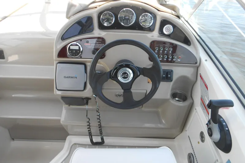 Slide: The Image of Steering console of a 2008 Sea Ray 260 Sundancer boat with Garmin navigation. - 6