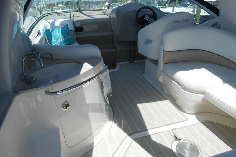 Slide: The Image of Interior of 2008 Sea Ray 260 Sundancer boat with seating and kitchenette. - 9