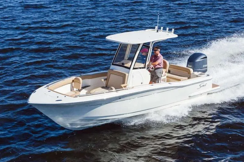 Slide: The Image of Manufacturer Provided Image: 2025 Scout 240 XSF boat cruising on open water. - 1