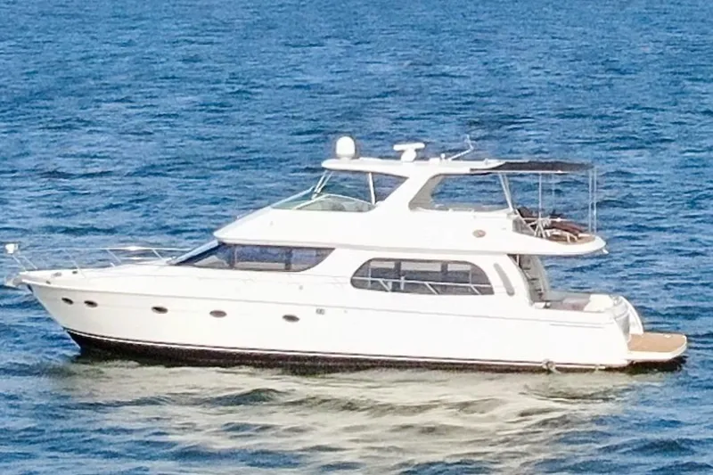 Slide: The Image of 2005 Carver 560 Voyager yacht cruising on open water. - 17