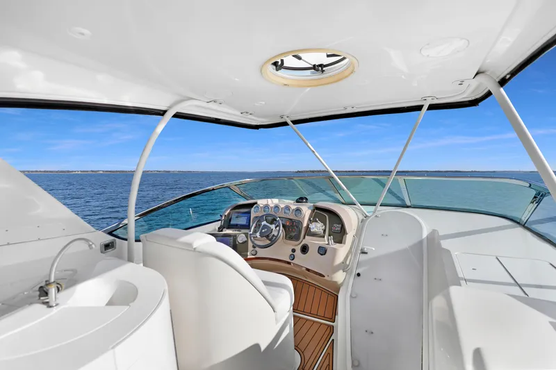 Slide: The Image of Interior view of 2005 Carver 560 Voyager yacht helm with ocean backdrop. - 30