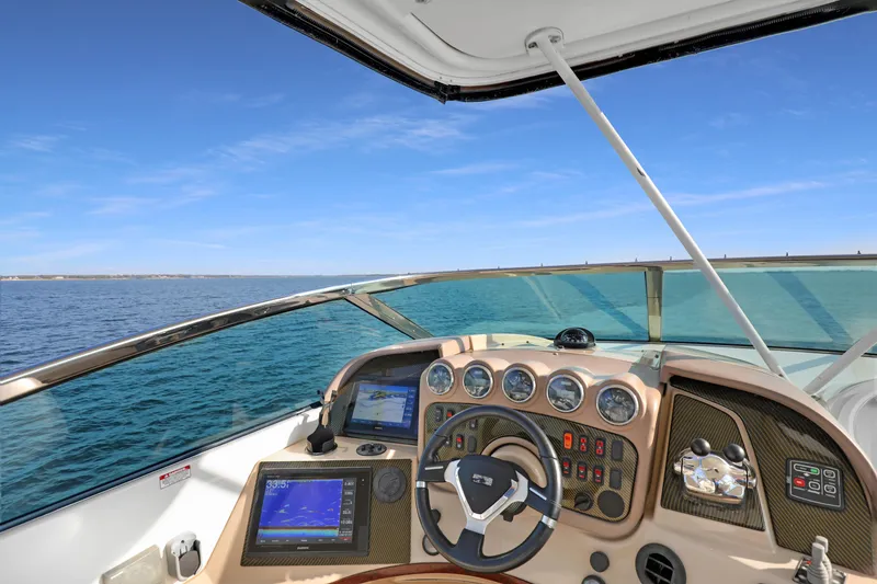 Slide: The Image of Helm of 2005 Carver 560 Voyager yacht with ocean view and navigation instruments. - 33