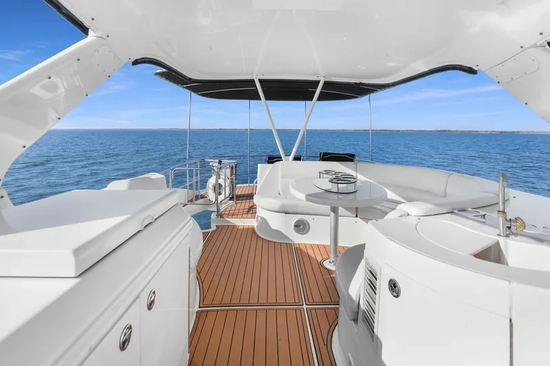 Slide: The Image of Luxurious 2005 Carver 560 Voyager yacht interior with elegant seating and ocean view. - 35