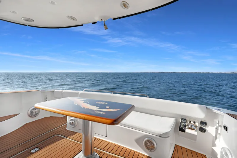 Slide: The Image of 2005 Carver 560 Voyager yacht deck with ocean view and seating area. - 39