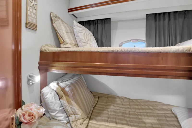 Slide: The Image of Bunk beds in 2005 Carver 560 Voyager yacht cabin with cozy bedding and decor. - 72