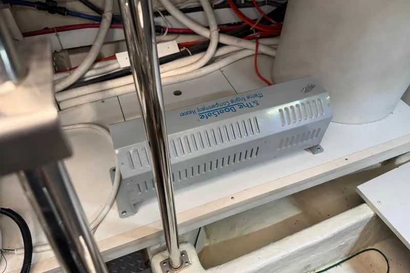 Slide: The Image of Engine compartment of 2005 Carver 560 Voyager with marine engine compartment heater. - 76