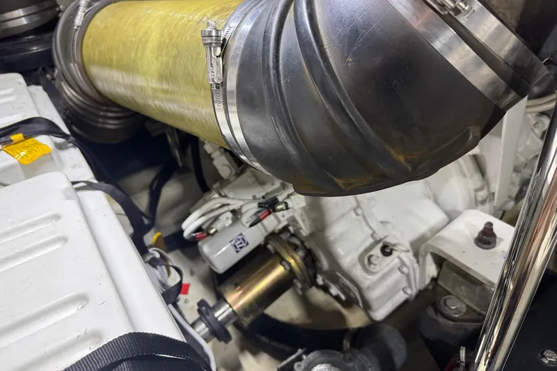 Slide: The Image of Engine compartment of a 2005 Carver 560 Voyager yacht, showcasing mechanical components. - 78