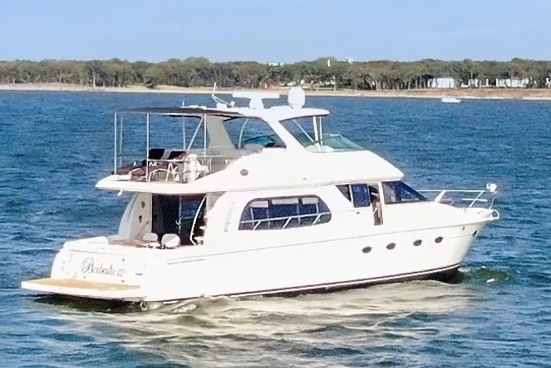 Slide: The Image of 2005 Carver 560 Voyager yacht cruising on a sunny day. - 13