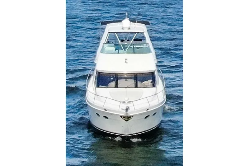 Slide: The Image of 2005 Carver 560 Voyager yacht cruising on open water. - 2