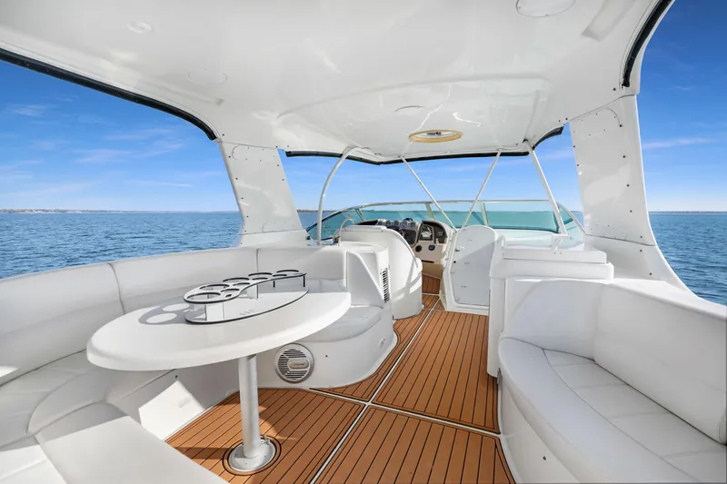 Slide: The Image of Luxurious 2005 Carver 560 Voyager yacht interior with elegant seating and ocean view. - 25