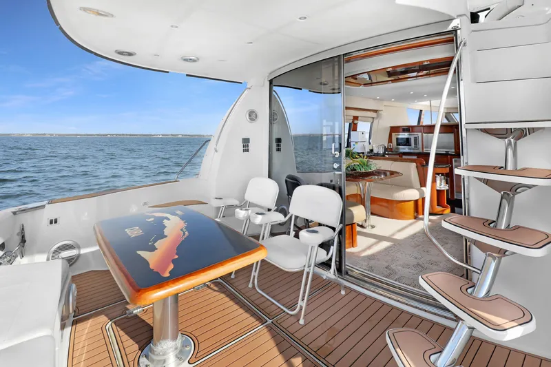 Slide: The Image of Luxurious 2005 Carver 560 Voyager yacht interior with elegant seating and ocean view. - 41