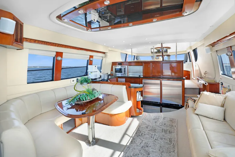 Slide: The Image of Luxurious interior of a 2005 Carver 560 Voyager yacht with elegant furnishings and panoramic windows. - 42