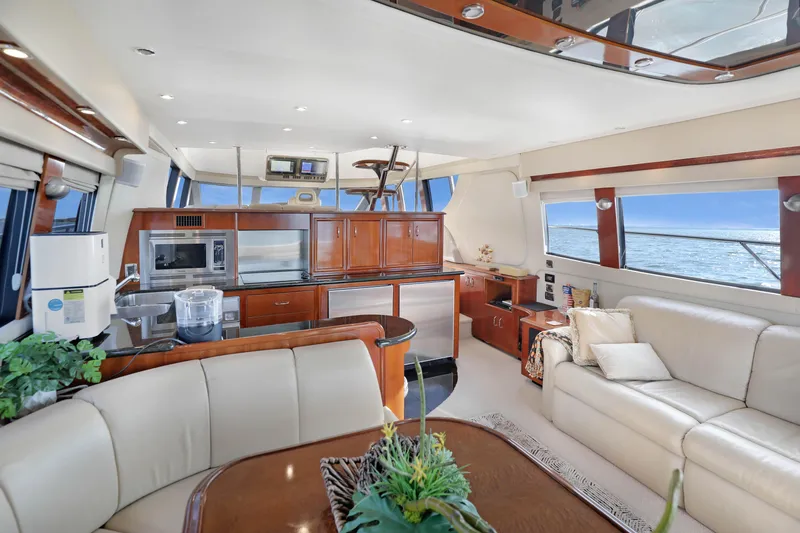Slide: The Image of Luxurious interior of 2005 Carver 560 Voyager yacht with modern kitchen and comfortable seating. - 44