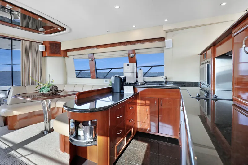 Slide: The Image of Luxurious interior of 2005 Carver 560 Voyager yacht with modern kitchen and seating area. - 46