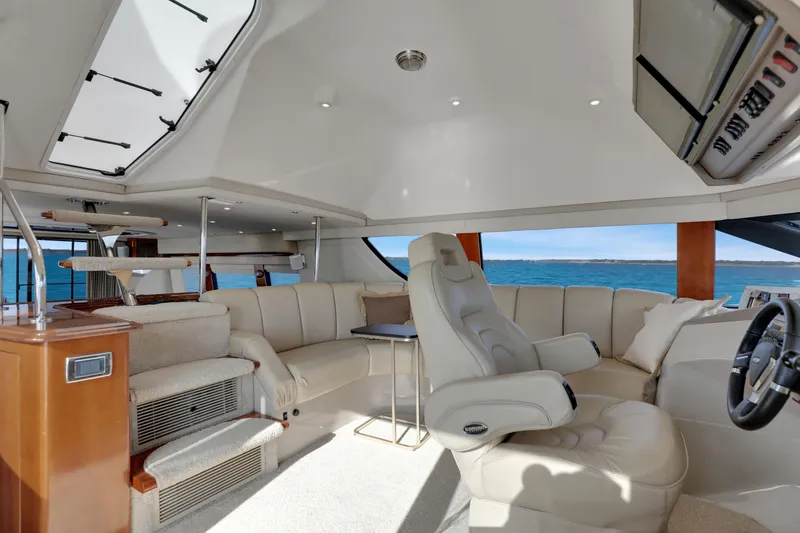 Slide: The Image of Luxurious interior of 2005 Carver 560 Voyager yacht with plush seating and ocean view. - 53