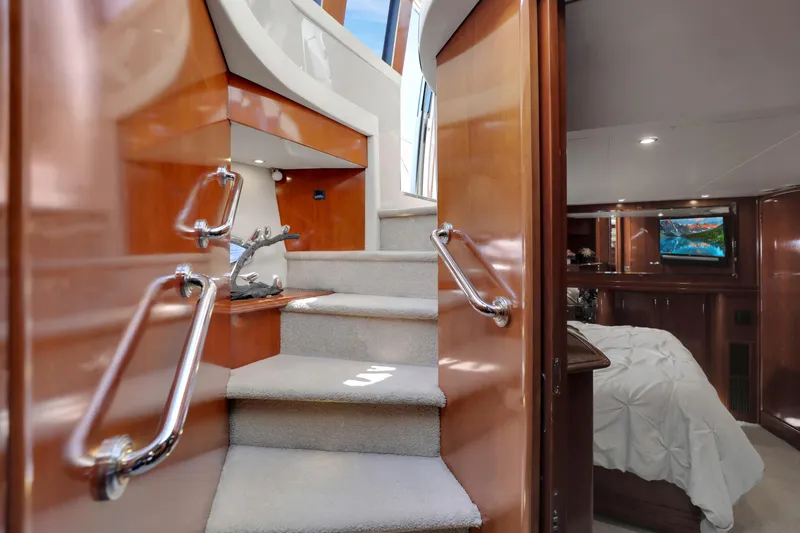 Slide: The Image of Luxurious interior of 2005 Carver 560 Voyager yacht with staircase and bedroom. - 59