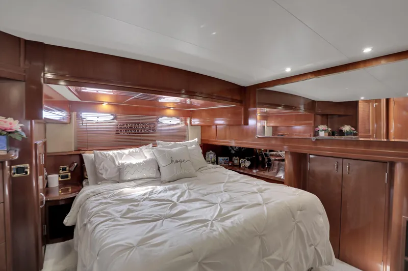 Slide: The Image of Luxurious bedroom interior of 2005 Carver 560 Voyager yacht with elegant wood finish. - 60