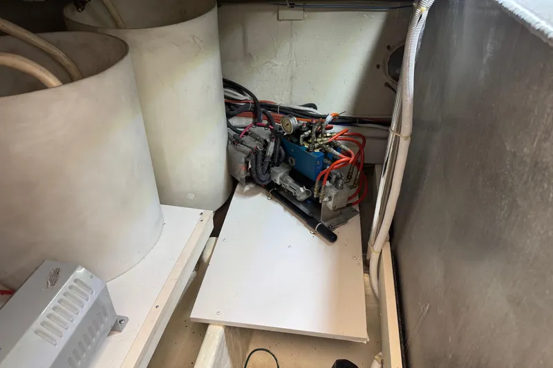 Slide: The Image of Engine room of 2005 Carver 560 Voyager with visible machinery and wiring. - 75