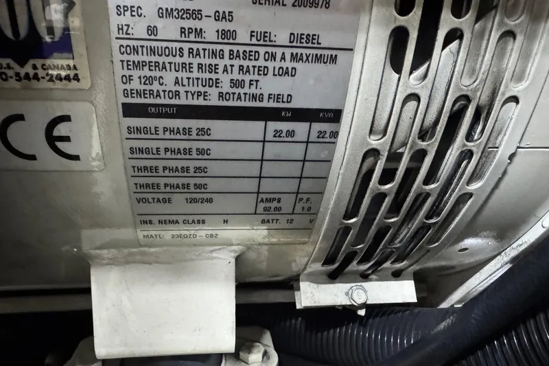 Slide: The Image of 2005 Carver 560 Voyager generator label, diesel, 60 Hz, 1800 RPM, 22 kW output. - 83