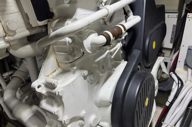 Slide: The Image of Engine components of a 2005 Carver 560 Voyager yacht, showcasing intricate mechanical details. - 87