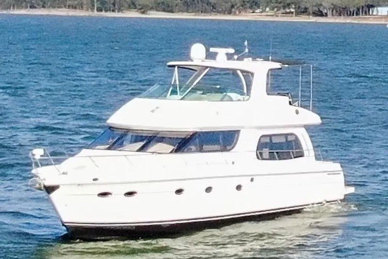 Slide: The Image of 2005 Carver 560 Voyager yacht cruising on open water. - 9