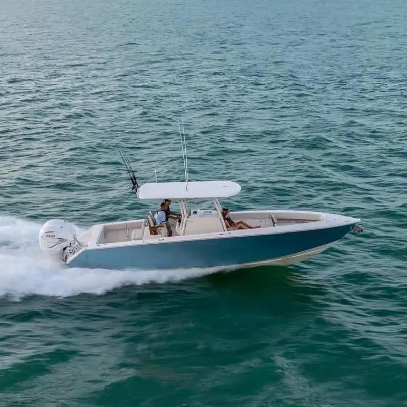 The Image of 2025 Jupiter 34 boat cruising on open water, featuring sleek design and powerful engines. - 0