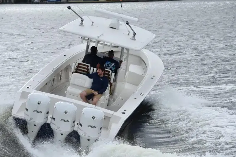 Slide: The Image of 2025 Jupiter 34 boat cruising on water with triple engines. - 7