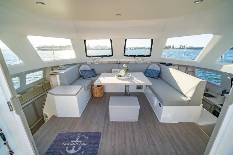 Slide: The Image of Luxurious interior of 2023 Seawind 1160 Lite catamaran with spacious seating and ocean view. - 1