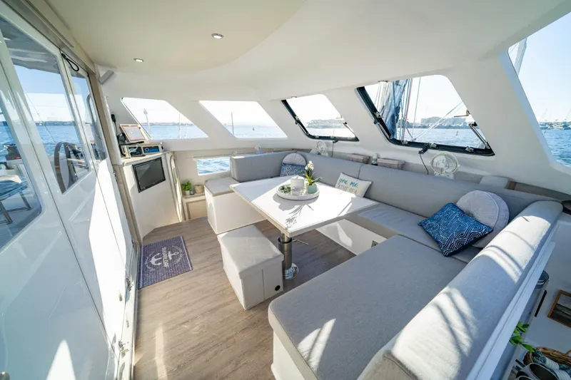 Slide: The Image of 2023 Seawind 1160 Lite yacht interior with spacious seating and ocean view. - 14