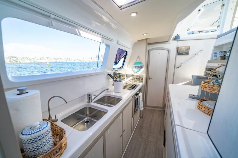 Slide: The Image of Modern kitchen interior of 2023 Seawind 1160 Lite catamaran with ocean view. - 16