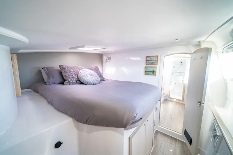 Slide: The Image of Cozy bedroom in 2023 Seawind 1160 Lite catamaran with modern decor and natural light. - 20