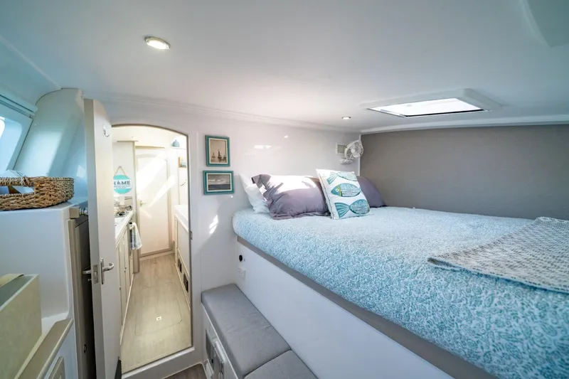 Slide: The Image of 2023 Seawind 1160 Lite interior cabin with cozy bed and modern decor. - 25