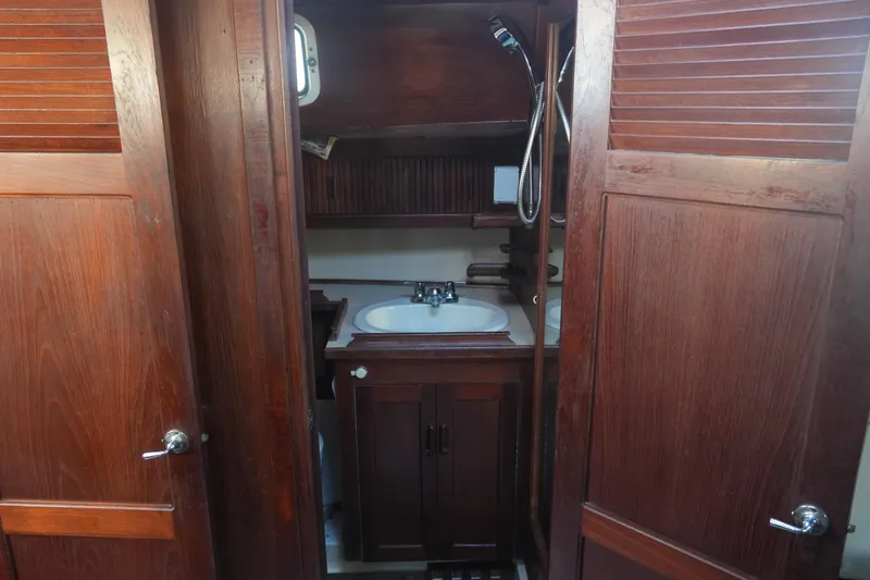 Slide: The Image of 1979 Endeavour 37 yacht bathroom with wooden cabinetry and sink. - 19