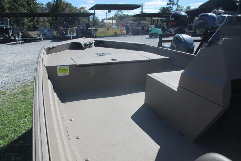 Slide: The Image of 2025 Alweld 1652 Marsh boat interior, showcasing spacious deck and seating area. - 10