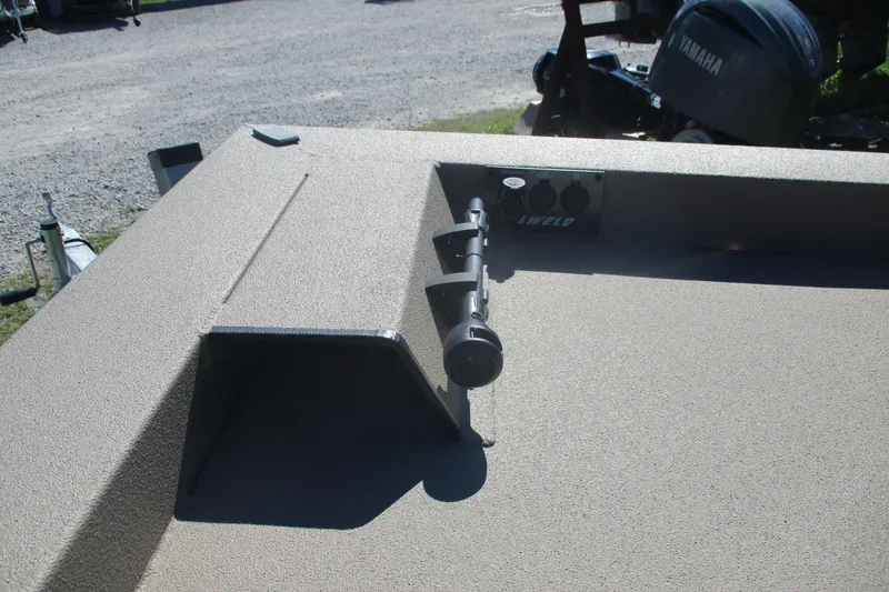 Slide: The Image of 2025 Alweld 1652 Marsh boat interior with rod holder and textured surface. - 11