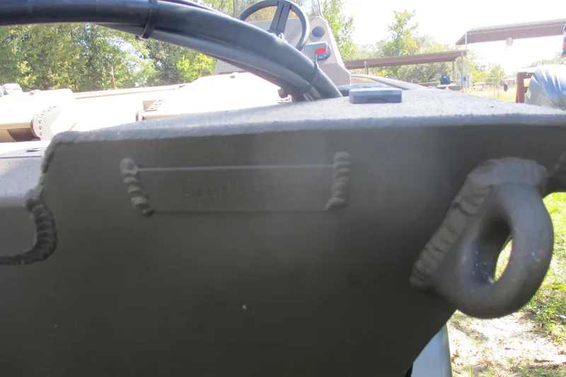 Slide: The Image of 2025 Alweld 1652 Marsh boat detail, showing steering wheel and welded components. - 12