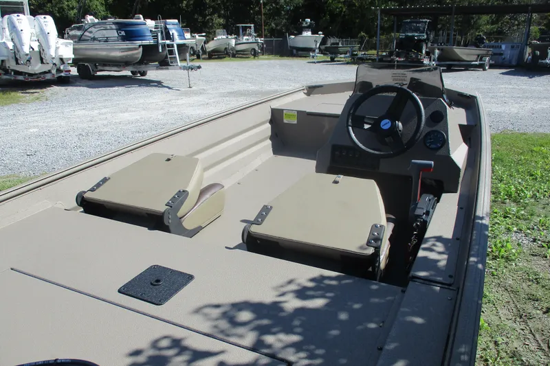 Slide: The Image of 2025 Alweld 1652 Marsh boat interior with steering console and seating. - 6