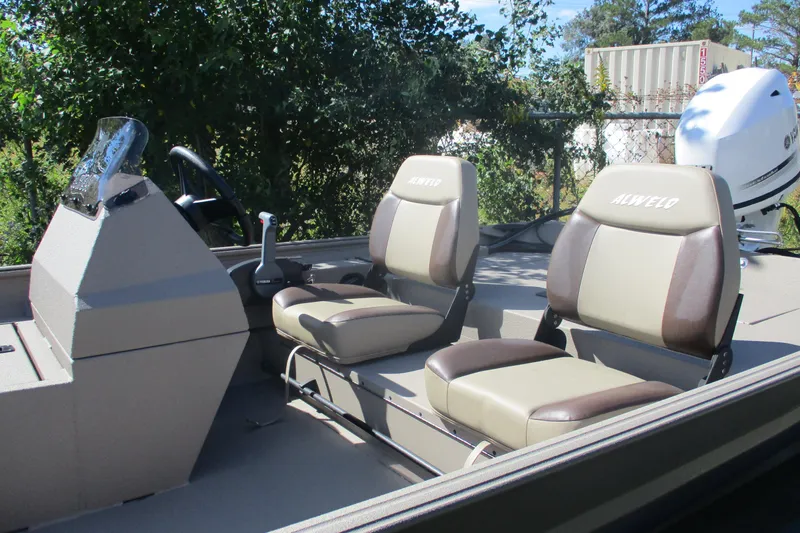 Slide: The Image of 2025 Alweld 1652 Marsh boat interior with dual seats and steering console. - 9