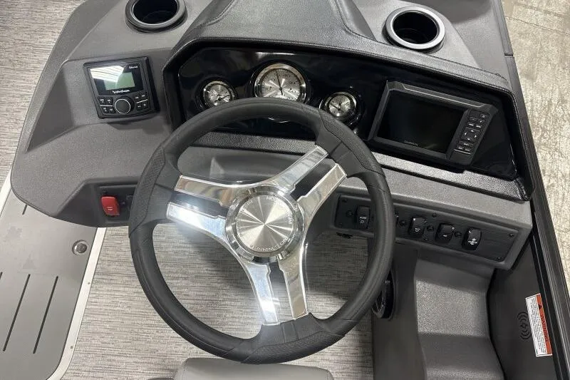 Slide: The Image of Steering console of 2026 Bennington 22 SSRSE boat with modern controls and gauges. - 22