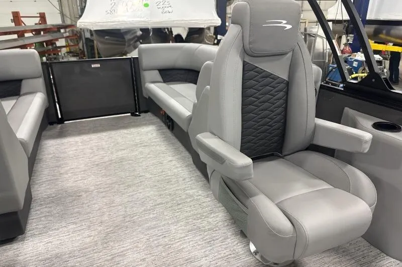 Slide: The Image of 2026 Bennington 22 SSRSE boat interior with luxurious gray seating and modern design. - 25