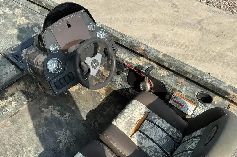 Slide: The Image of 2015 Ranger RT188 boat interior with camouflage design and steering console. - 9