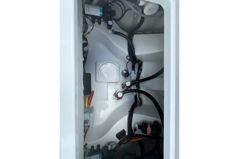 Slide: The Image of Livewell interior of 2025 Sportsman Masters 267OE Bay Boat, filled with water. - 14